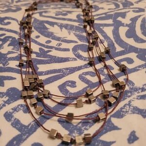 Multi-Layered Necklace with Metallic Accents